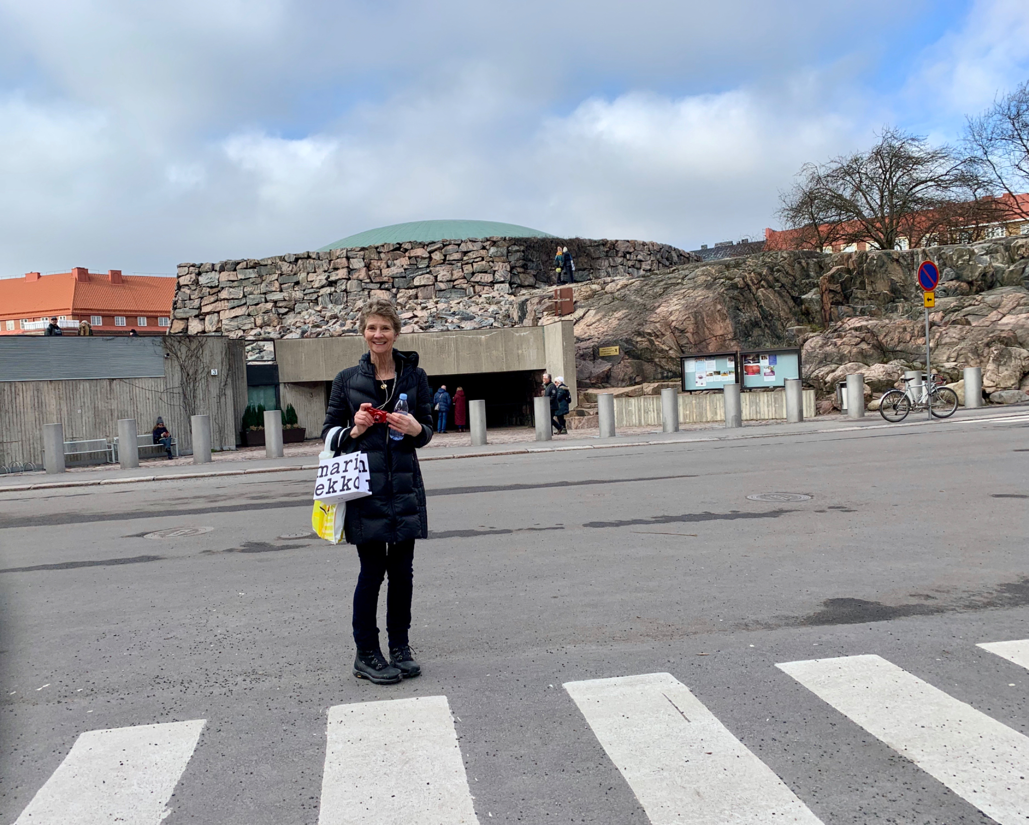Brenda in front of the entry to Temppeliaukio Church, aka Church of the Rock